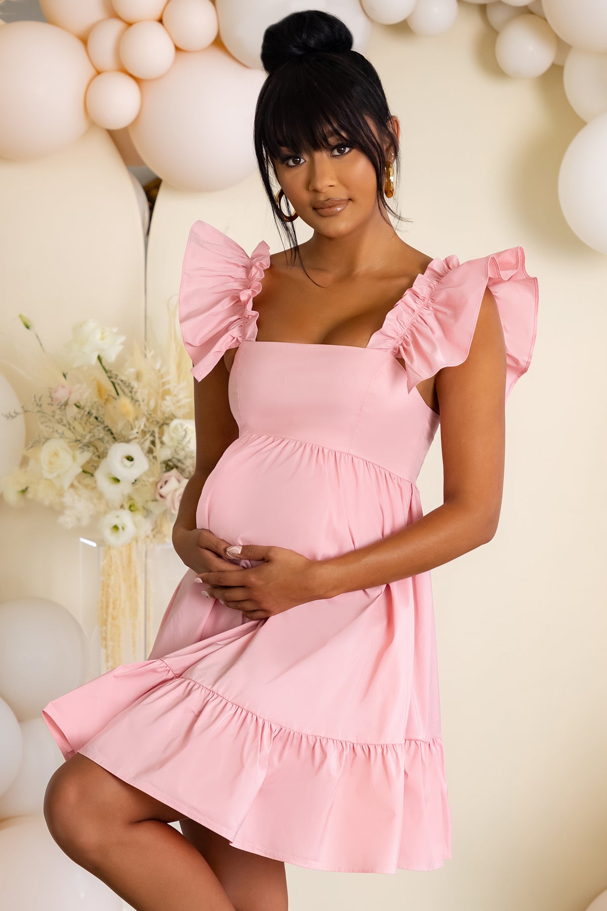 https://clubllondon.com/cdn/shop/products/CL126466-pink1-maternity-ruffle-mini-dress-3_1200x.jpg?v=1632130132